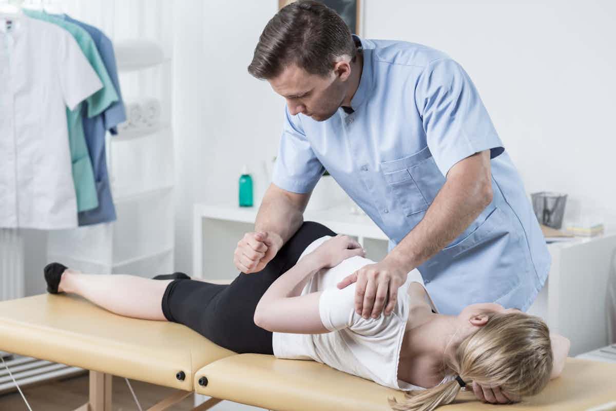 person getting a chiropractic adjustment as an alternative to back surgery