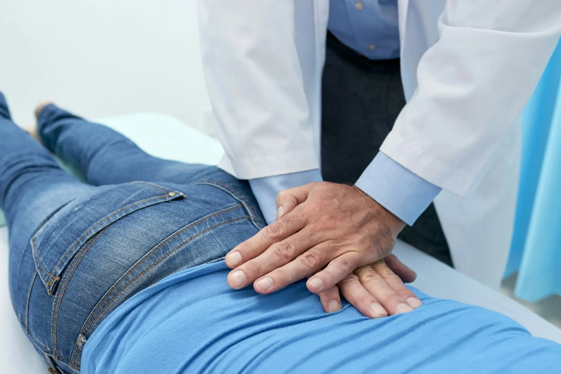 Chiropractor in Southwest Las Vegas performing spinal adjustment on patient to relieve back pain, neck pain, and headaches.