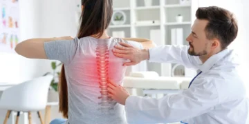 Chiropractor in Southwest Las Vegas helping patient with back pain and neck pain after car accident rehab